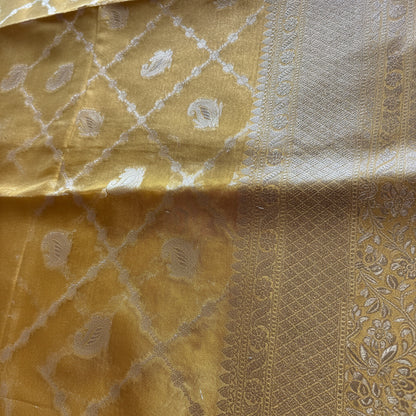 Close-up of a gold fabric with intricate patterns